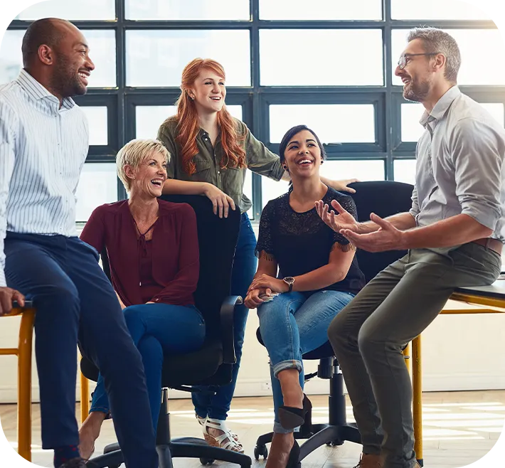 team of people sitting at desk